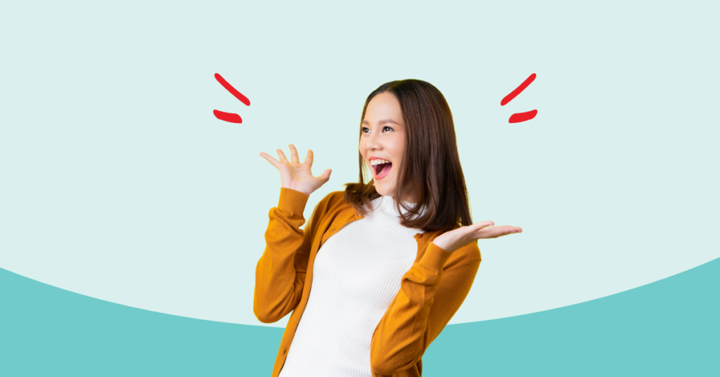 young women with hands in the air with excitement and happiness