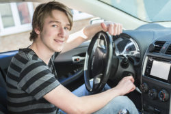 Teenager sitting in driver's seat of car | Honor Credit Union