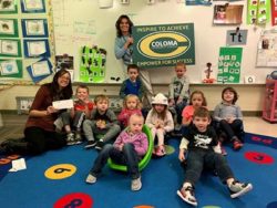 Coloma Community School's Teacher Brittany Brethauer and students with $100 Teacher Award | Honor Credit Union