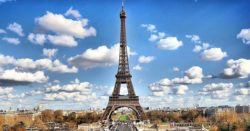 tips about using your honor credit union credit and debit cards during international travel; photo of the eifel tower in paris france | Honor Credit Union