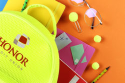 earn up to 2.00% APY with a 6-month certificate of deposit from honor credit union; backpack and school supplies resting on an orange surface | Honor Credit Union
