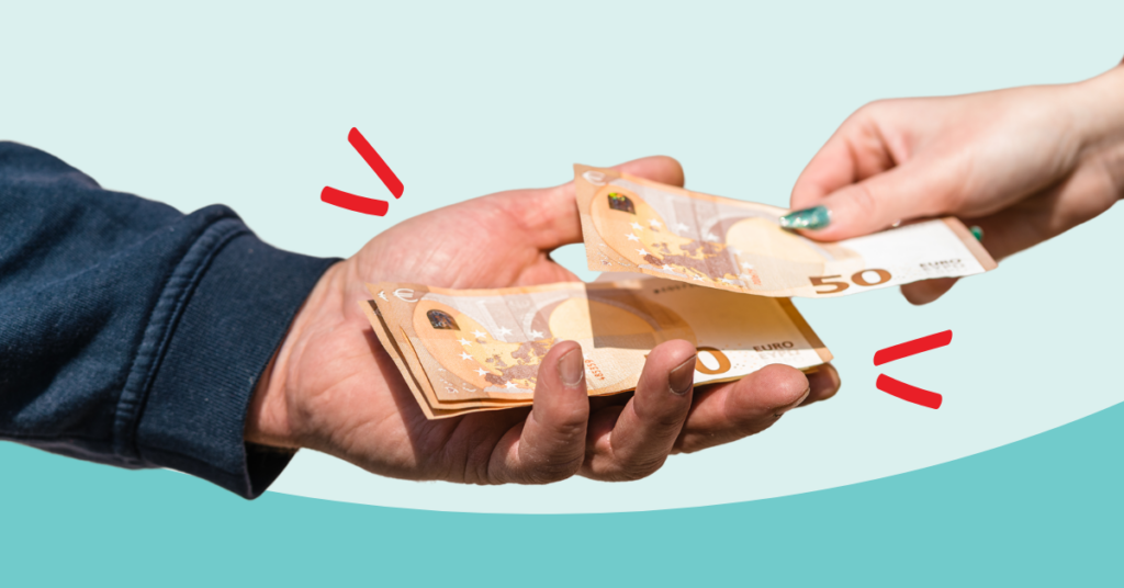 hands exchanging foreign currency