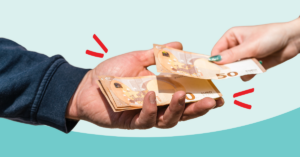 hands exchanging foreign currency | Honor Credit Union
