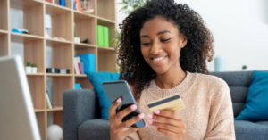 women shopping online with her credit card | Honor Credit Union