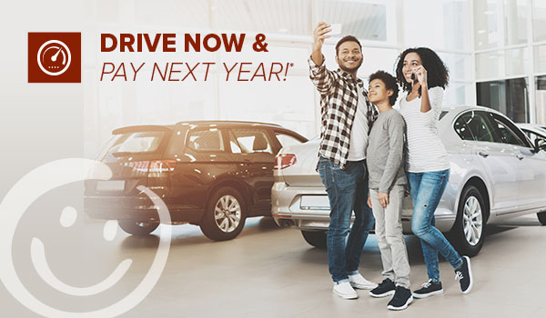 new auto loans no payments until 2020 at honor credit union; family taking a selfie at a car dealership