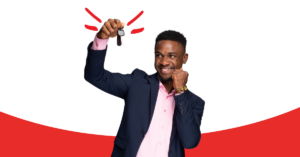 man holding car keys with excitement and fist up in excitement | Honor Credit Union