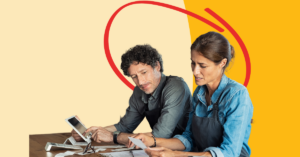 business owner holding an Honor Business credit card | Honor Credit Union