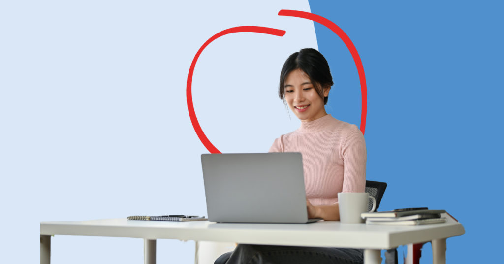 women looking at her laptop smiling