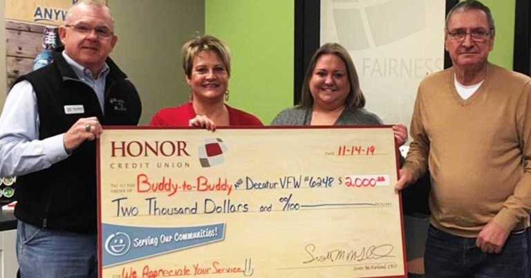honor credit union presents a check for $2,000 to representatives from the decatur vfw and buddy to buddy organization