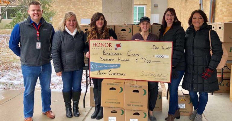 honor credit union partnered with bridgman cares to donate holiday meals to families in need