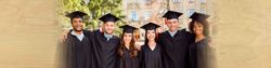 photo of a group of graduates wearing their caps and gowns posing together for a photo | Honor Credit Union