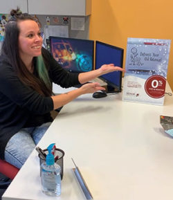 honor credit union balance transfers are a smart way to get out of credit card debt; photo of an honor team member discussing a balance transfer with a member | Honor Credit Union