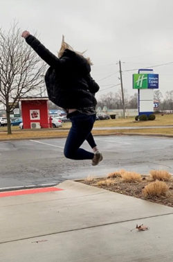 an honor credit union member leaves a member center happy after discussing a credit card balance transfer | Honor Credit Union