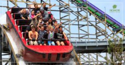 honor credit union members enjoy many additional benefits such as discounted amusement park rides; photo of children and adults riding on a roller coaster | Honor Credit Union