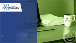 image of a laptop, stack of papers and coffee mug sitting on a desk | Honor Credit Union