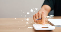 image of a person typing numbers on a calculator | Honor Credit Union
