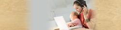 woman and daughter sitting together looking at a laptop | Honor Credit Union