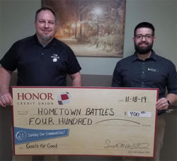 honor credit union's jamie gollakner presents a check to hometown battles non-profit organization | Honor Credit Union