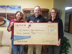 image of jamie gollakner from honor credit union presenting a check to the jacobetti veterans home | Honor Credit Union