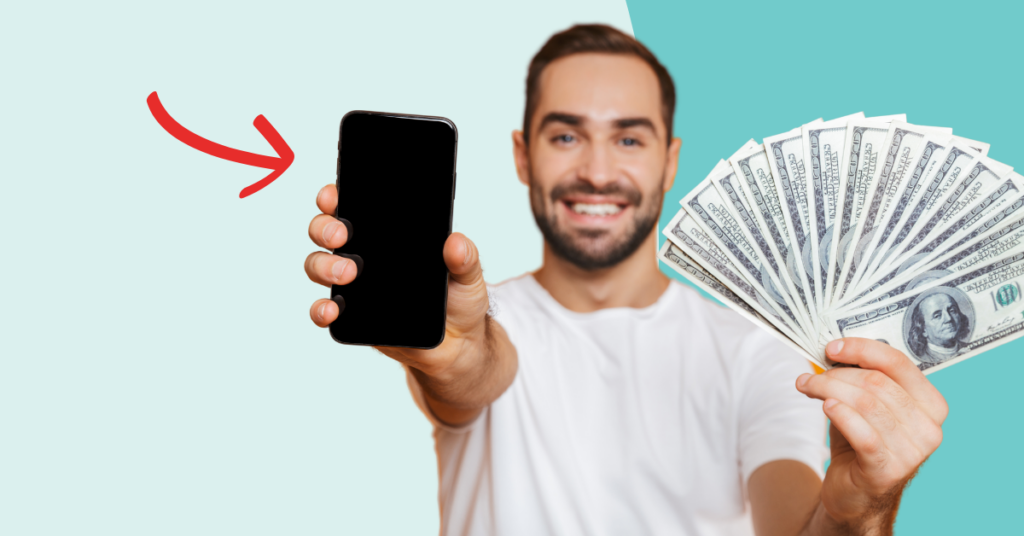 man holding a phone and cash