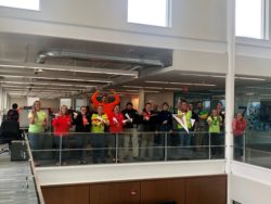 photo of honor team members throwing paper airplanes | Honor Credit Union