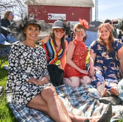 photo of women sitting at round barn winery and distillery on a sunny day | Honor Credit Union
