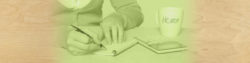 image of a woman writing a check at a table next to a calculator and coffee mug | Honor Credit Union