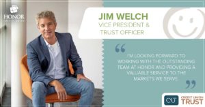 photo of CU Trust Vice President Jim Welch wearing jeans and a blue suit coat sitting in a orange chair | Honor Credit Union