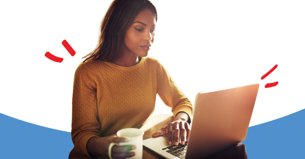 women looking at a computer screen holding a cup of coffee while learning about how to protect herself from scam attacks