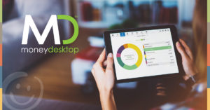 image of a person holding a tablet device that is showing the moneydesktop resource on the screen | Honor Credit Union