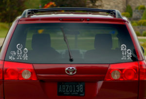 image of stick figures on a rear windshield of a vehicle | Honor Credit Union