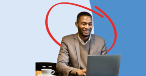 man using his laptop smiling protecting his internet connection at a cafe | Honor Credit Union