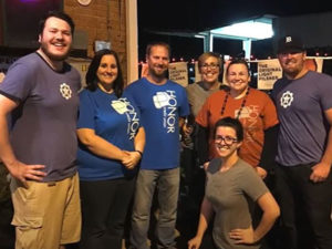 photo of a group of honor credit union team members posing for a photo at a community event | Honor Credit Union