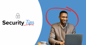 man using his laptop smiling protecting his internet connection at a cafe | Honor Credit Union