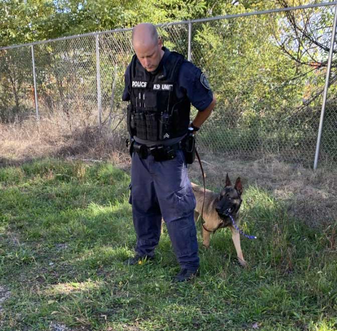 photo of battle creek police department patrol dog skube with handler corporal kevin farnham