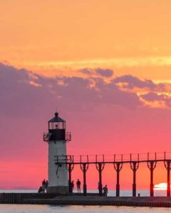 image of lighthouse in saint joseph michigan at sunset | Honor Credit Union