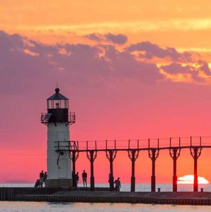 image of lighthouse in saint joseph michigan at sunset | Honor Credit Union