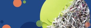image of shredded paper on a blue background with green and orange circles | Honor Credit Union