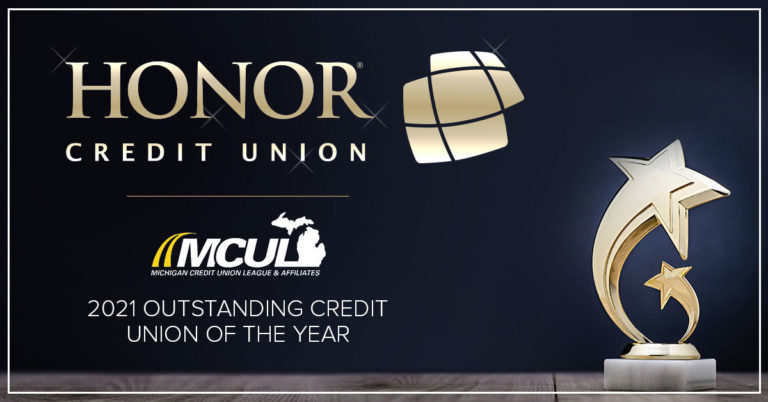 image of a trophy on a blue background with text explaining honor credit union won an award from the michigan credit union league