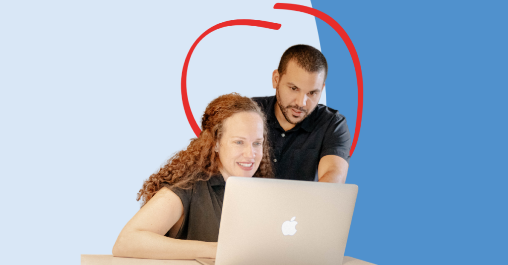 couple looking a laptop together