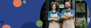 man and woman standing in front of a business with their arms folded across their chests | Honor Credit Union