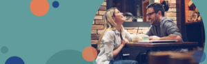 man and woman laughing together while sitting in a restaurant | Honor Credit Union
