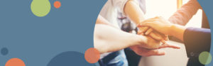 group of people putting their hands together | Honor Credit Union