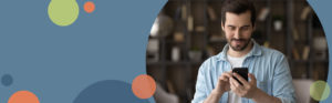 man looking at a mobile phone | Honor Credit Union