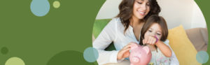 mother and daughter putting coins in a piggy bank | Honor Credit Union