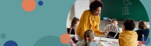 teacher working with students in a classroom | Honor Credit Union