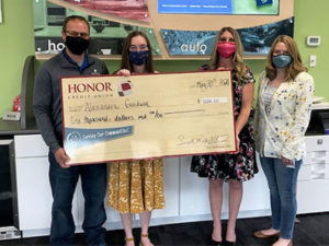 plainwell scholarship check presentation | Honor Credit Union