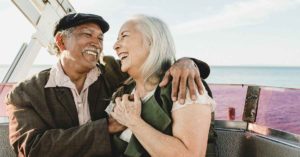 older couple smiling sitting next to each other | Honor Credit Union
