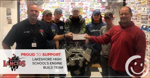 photo of lakeshore high school's engine build team being presented a check by honor credit union ceo scott mcfarland | Honor Credit Union