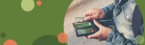 person pulling an honor select rewards credit card out of a wallet | Honor Credit Union